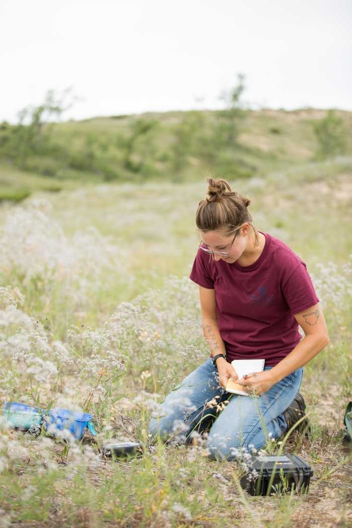 Hailee Pavisich takes a sample that will be used to provide a genetic signature for that specific plant.